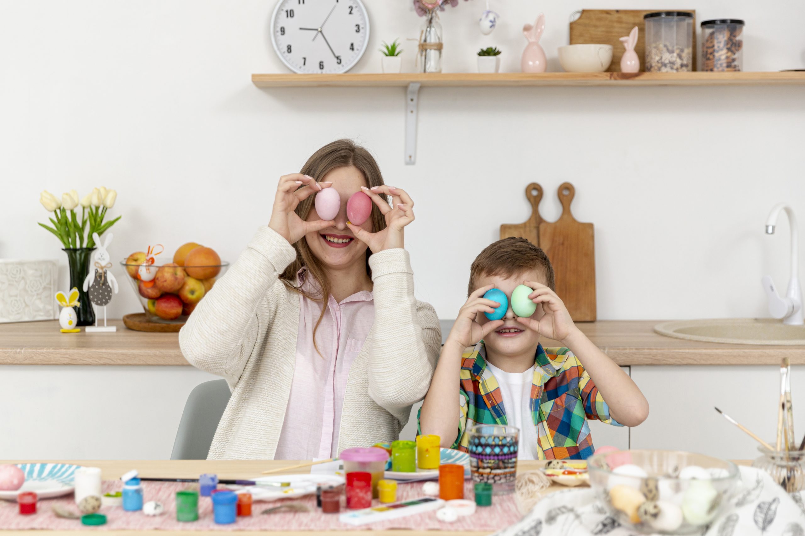 playful-mom-son-covering-eyes-with-painted-eggs-scaled playful-mom-son-covering-eyes-with-painted-eggs-scaled
